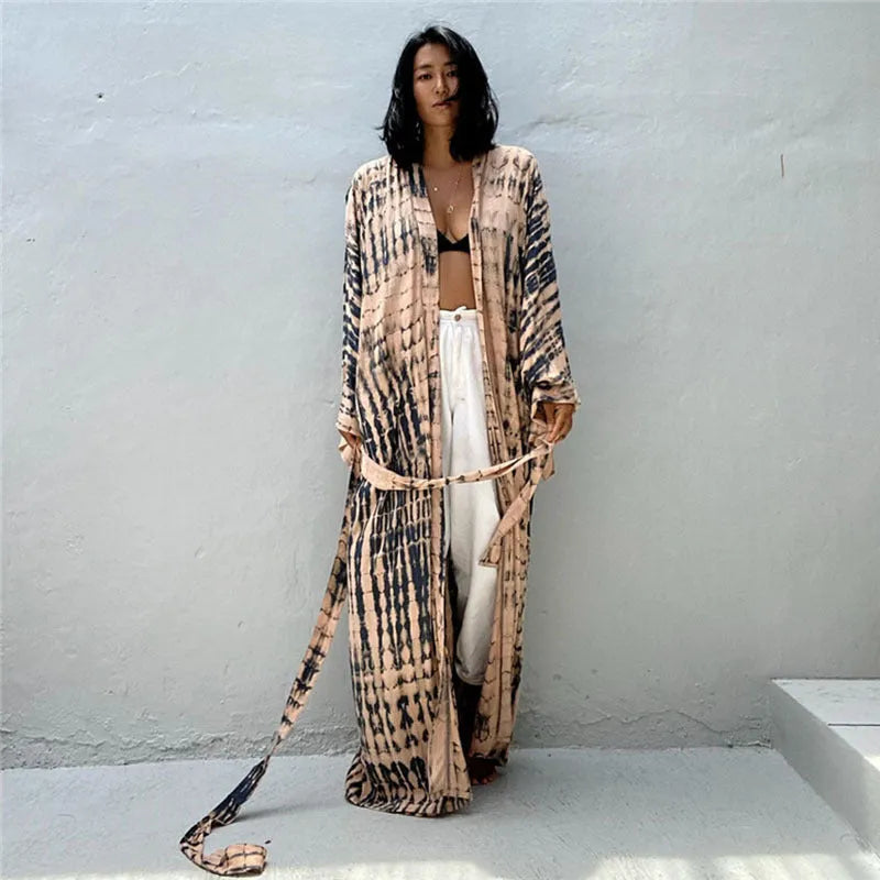 Woman wearing a printed cotton beach cover-up blouse in a DN0712 series colour.