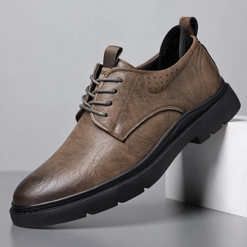 Men's black and brown leather casual sneakers with rubber soles and sewn detailing