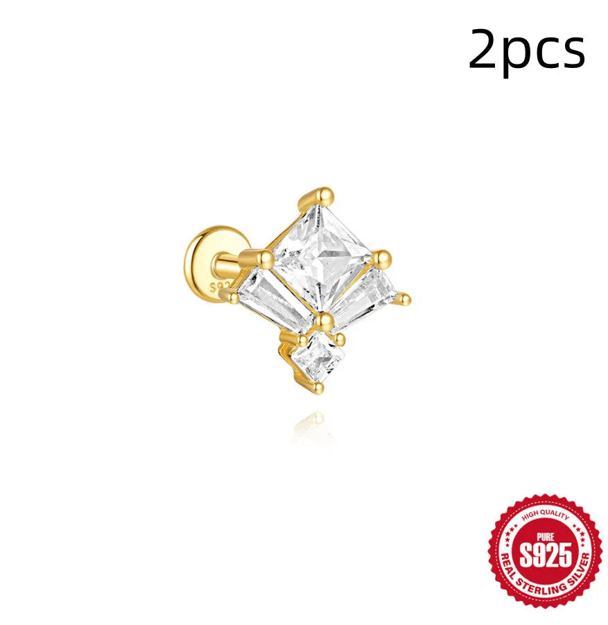 S925 sterling silver geometric stud earrings with inlaid zircon in golden clover, crown, and chain designs.