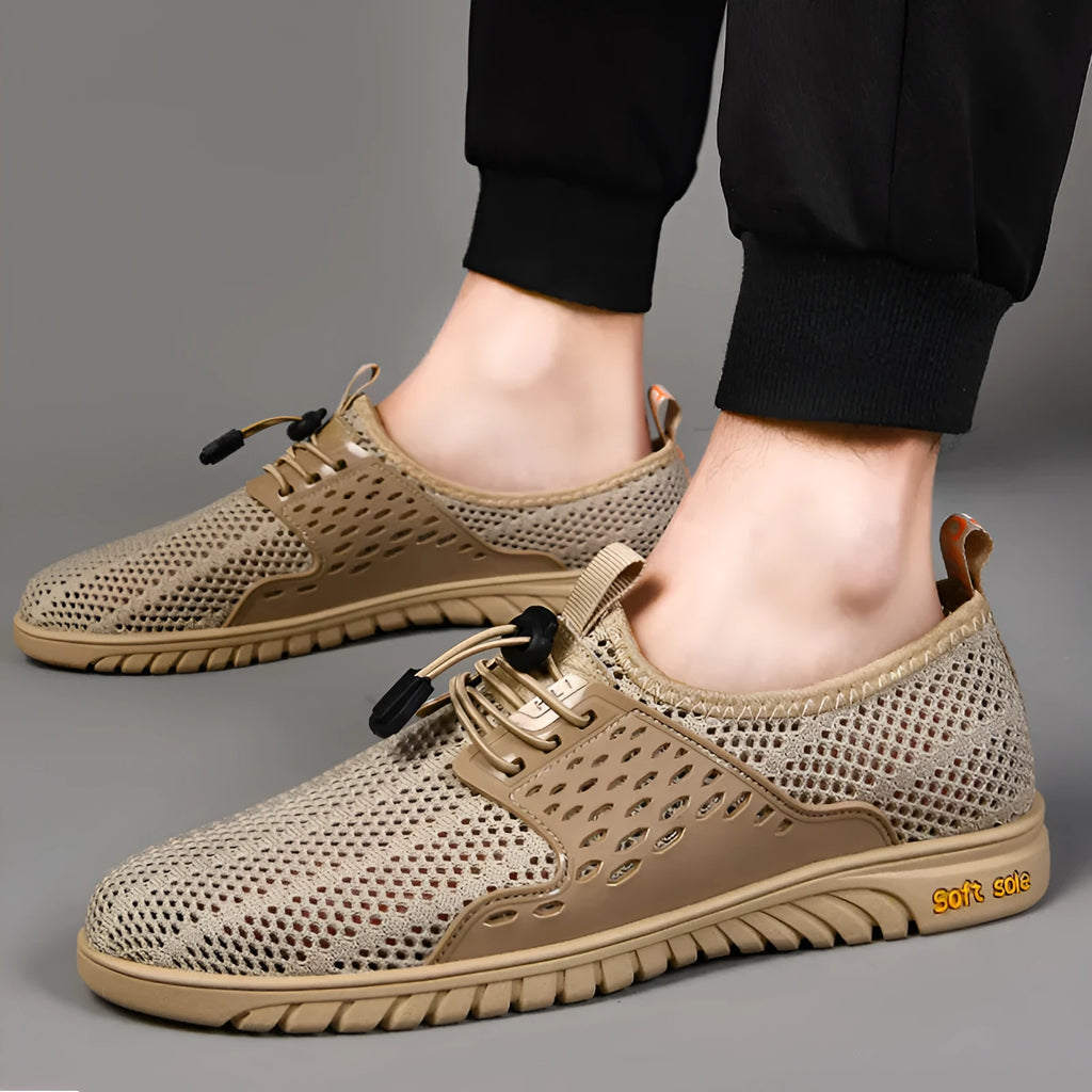 Men's black breathable mesh casual shoes with an elastic band closure and rubber sole