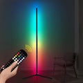 Black smart RGB floor lamp with remote control on household floor