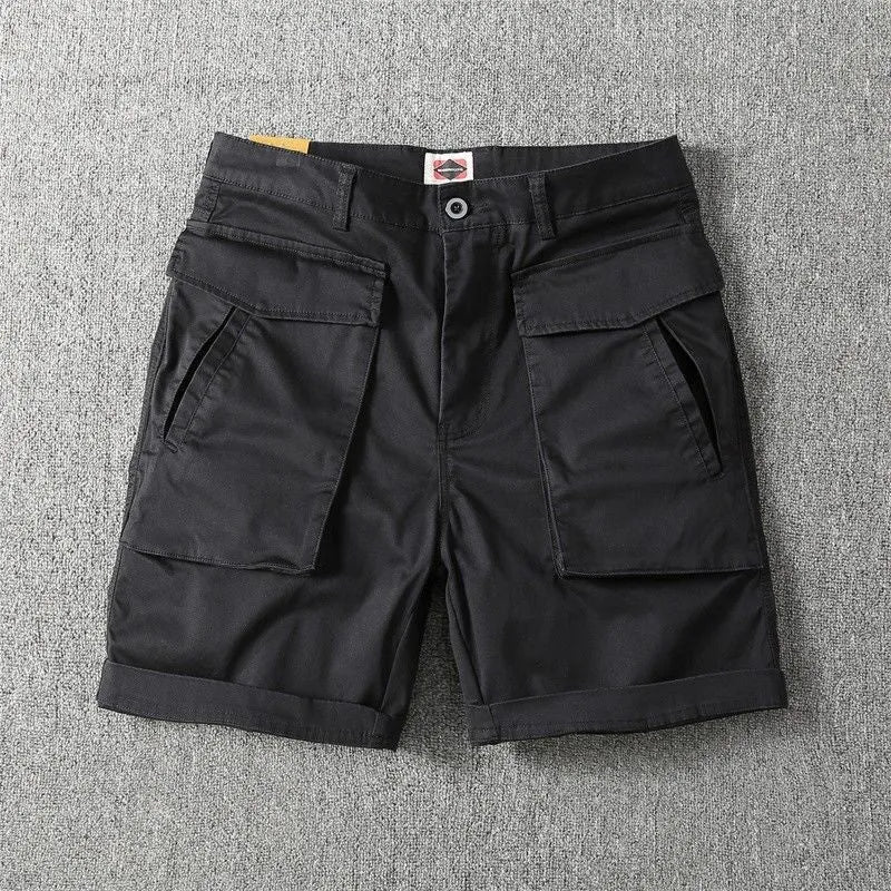 Men's army green cotton cargo shorts with multiple pockets, shown in a straight-leg summer street style.