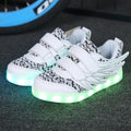 Plum red children's LED light-up sneakers with colourful flashing soles on a white background.