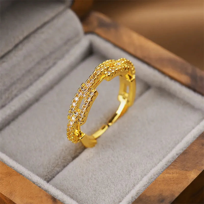 Gold electroplated copper geometric open ring in Korean fashion style, showing adjustable design.