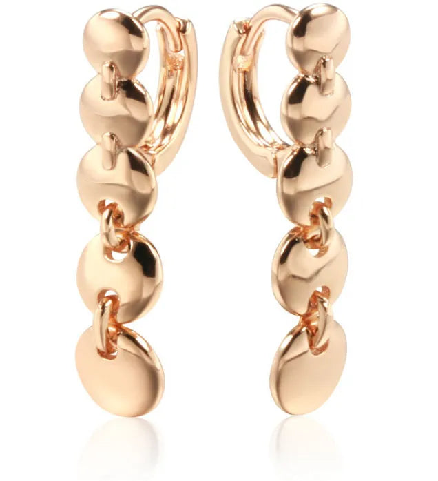 Gold retro woven hoop earrings showing full circle and textured copper surface