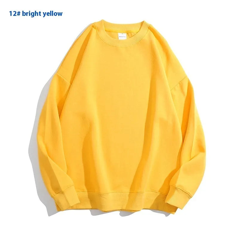A loose-fitting, off shoulder, round neck cotton sweater in a solid colour with long sleeves.