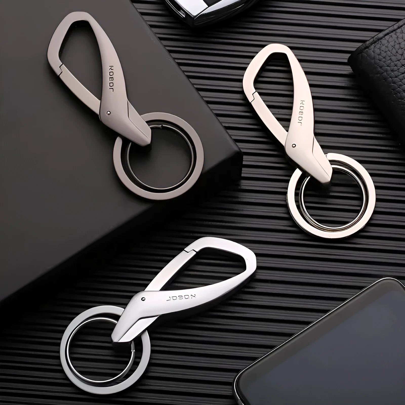 Zinc alloy double key ring for car keys in black, chrome, or nickel finish, shown next to a 30cm ruler for scale.