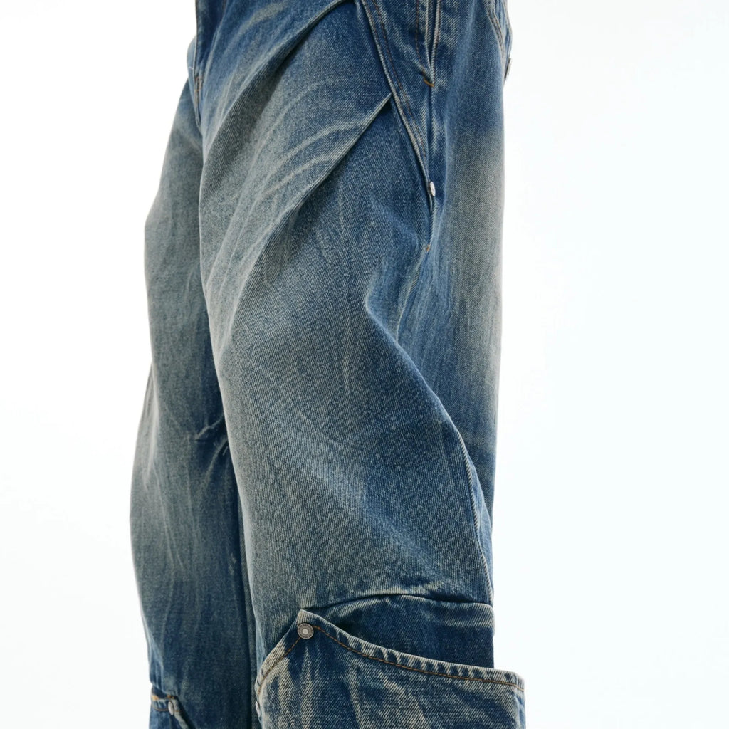 Men's verdant blue curved knife jeans with washed burst pattern and loose fit design