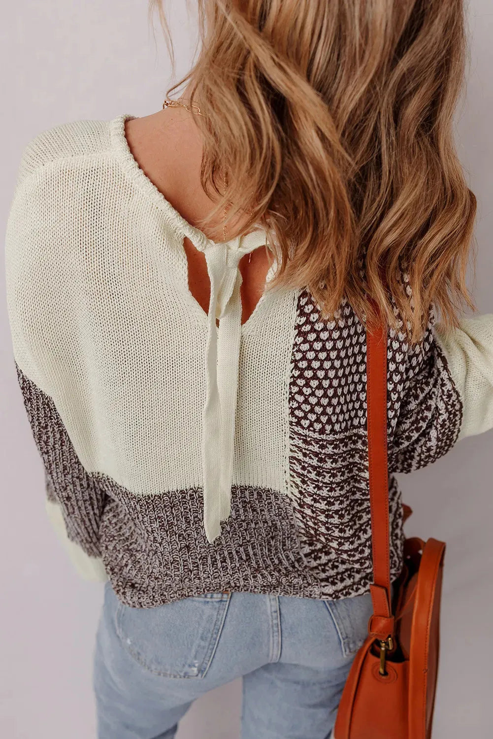 Dark khaki women's sweater with colour block design, back tie detail, and drop shoulder loose fit