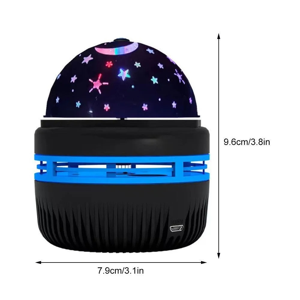 Compact USB-powered LED lamp projecting rotating colourful stars and galaxies onto a dark wall.
