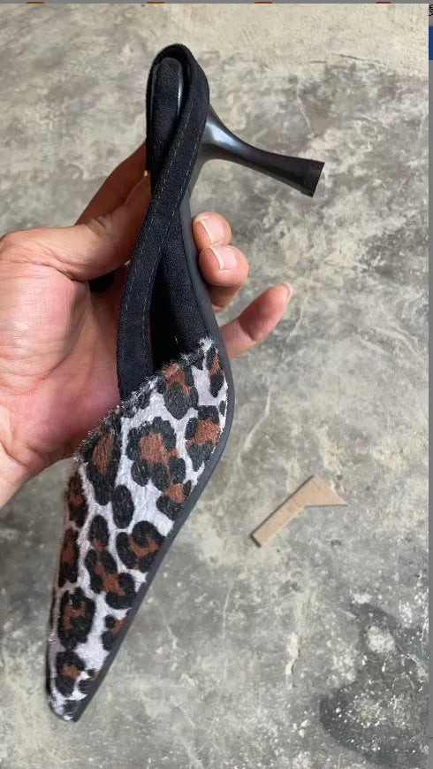 Women's leopard print suede sandals with pointed toe and high heel design on white background