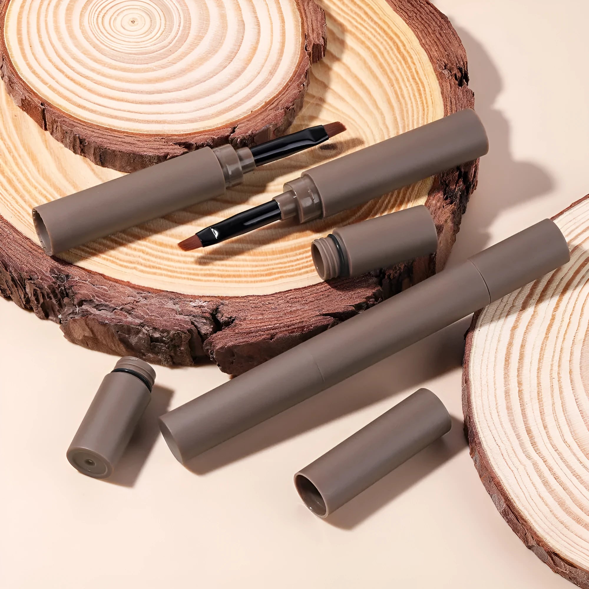 Double-headed eyebrow cream kit showing pencil and powder ends with five shade options displayed.