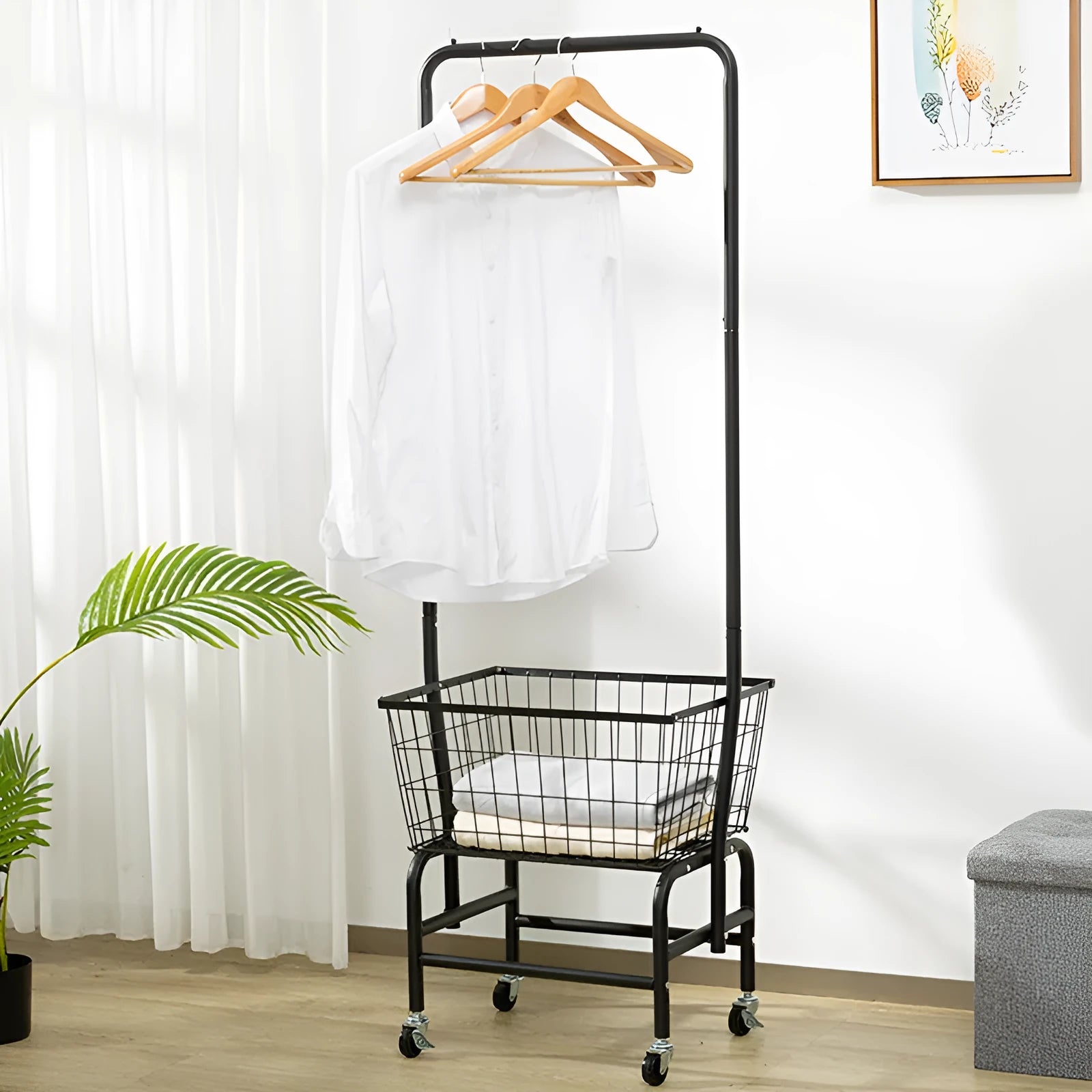 White iron single rod pulley clothes hanger rail mounted on a wall for tie and trouser storage.