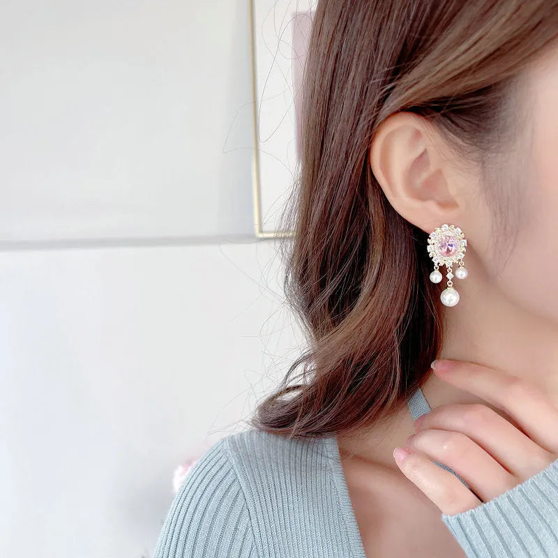 Oval geometric copper earrings with inlaid zircon stones and pearl tassel drops in light purple colour