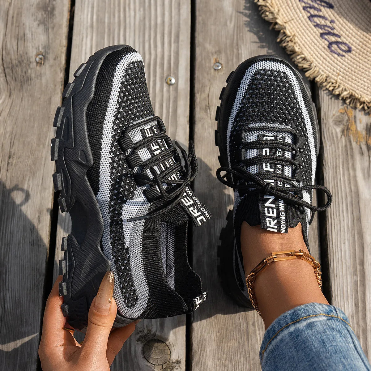 Women's Flyknit mesh lace-up sneakers in grey and white colourway