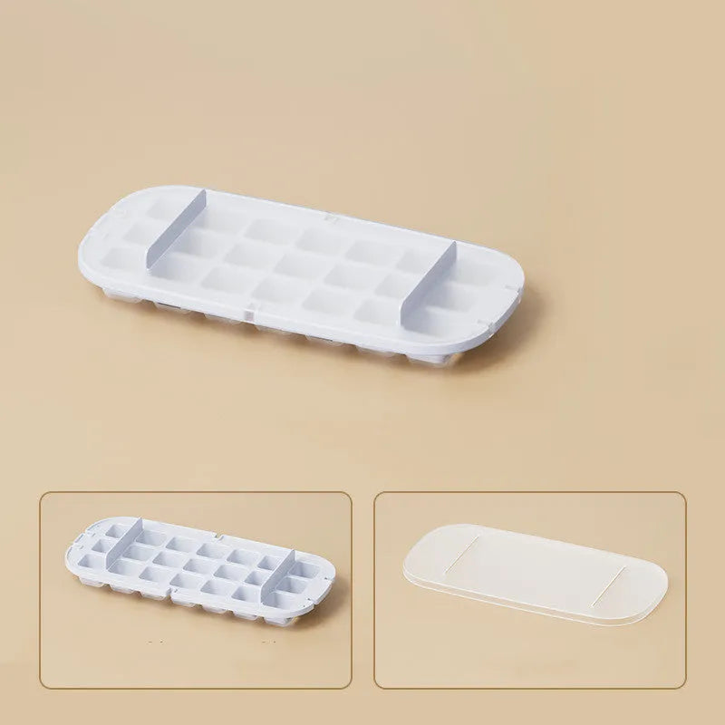 High-capacity ice cube tray in blue with leverage handle and integrated ice shovel storage compartment