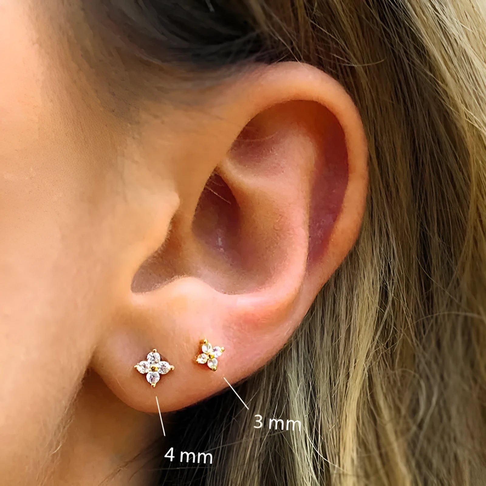 S925 sterling silver stud earrings with small crystal flower petals in gold and platinum finishes.