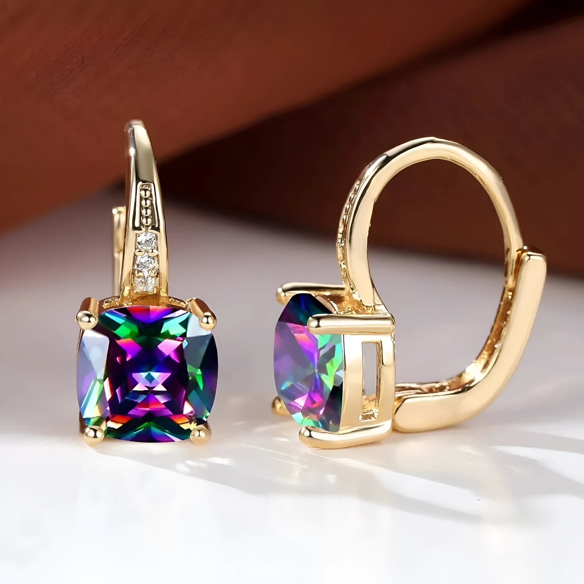 Geometric copper ear clip with colourful moissanite stones in quadrilateral pattern