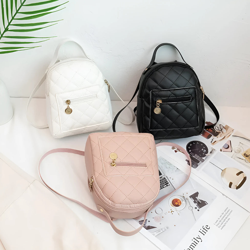 Girls' hard-shell vertical square backpack with embroidery in pink, showing front view and soft carry handle.