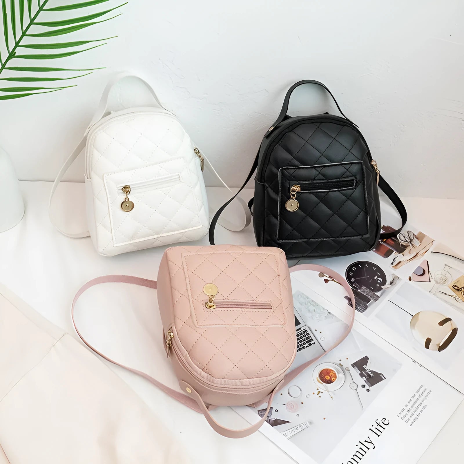 Girls' hard-shell vertical square backpack with embroidery in pink, showing front view and soft carry handle.