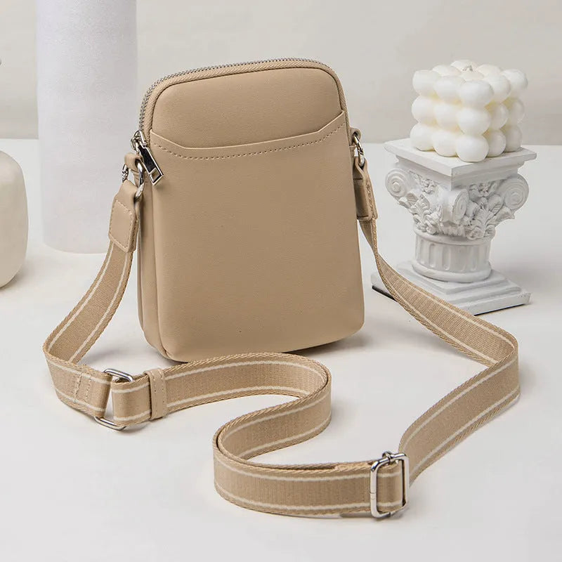 Small solid colour mobile phone crossbody bag in PU leather measuring 14.5cm wide