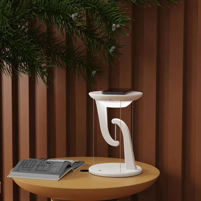 White creative smart wireless phone charger suspension lamp on desk with USB cable