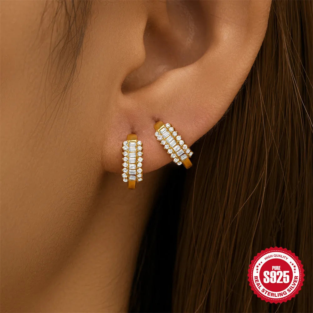 Sterling silver geometric stud earrings with small round design elements in gold or silver finish