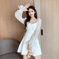 White chiffon patchwork waist-slimming dress with long sleeves and maxi skirt length on mannequin