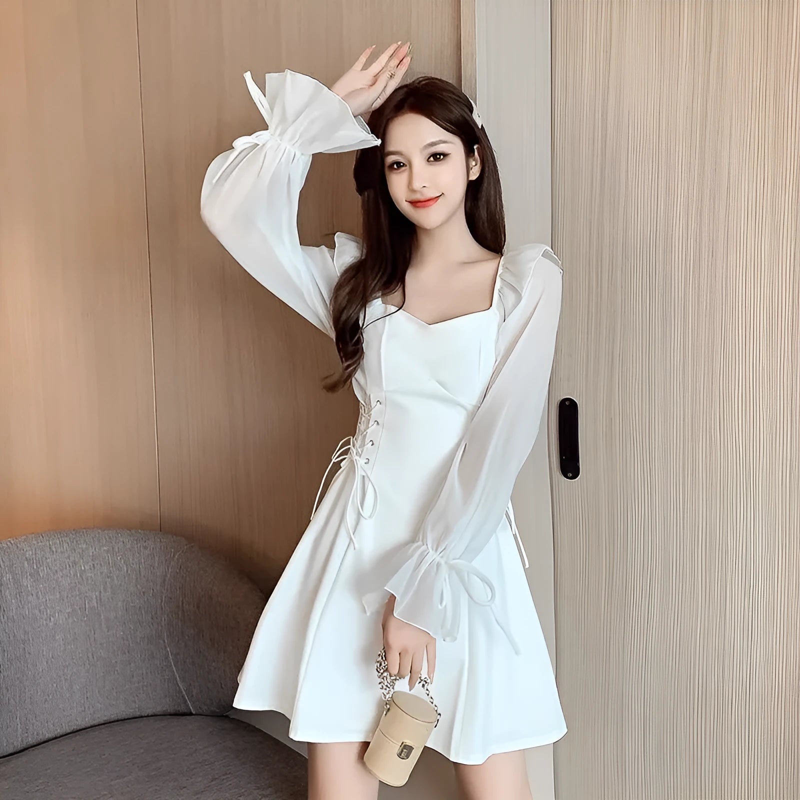White chiffon patchwork waist-slimming dress with long sleeves and maxi skirt length on mannequin