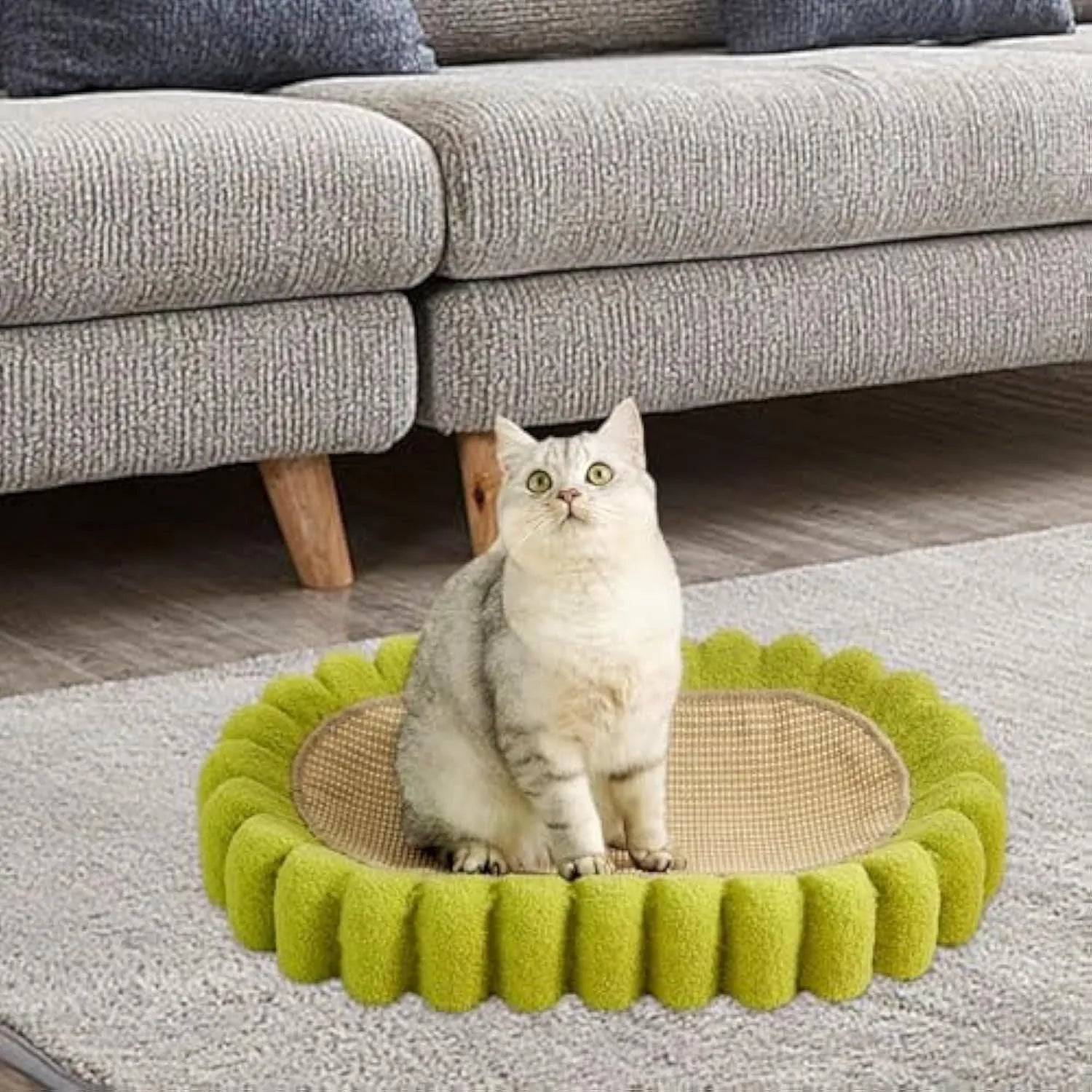 Green oval sisal cat scratching pad and bed measuring 650mm long