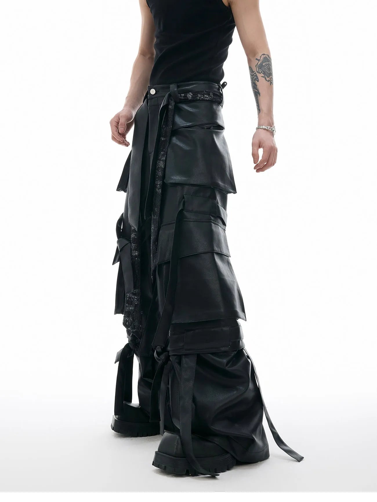 Men's black loose-fit quilted trousers with multiple pockets and heavy stitching