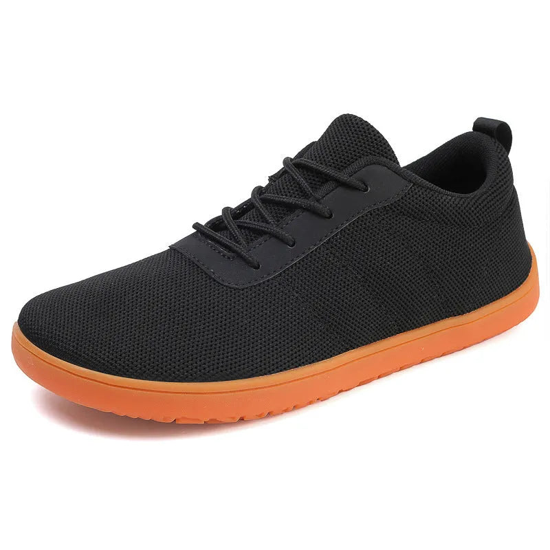 Men's low top walking shoes in Flyknit with non-slip rubber sole, shown in black colour with lace-up front.