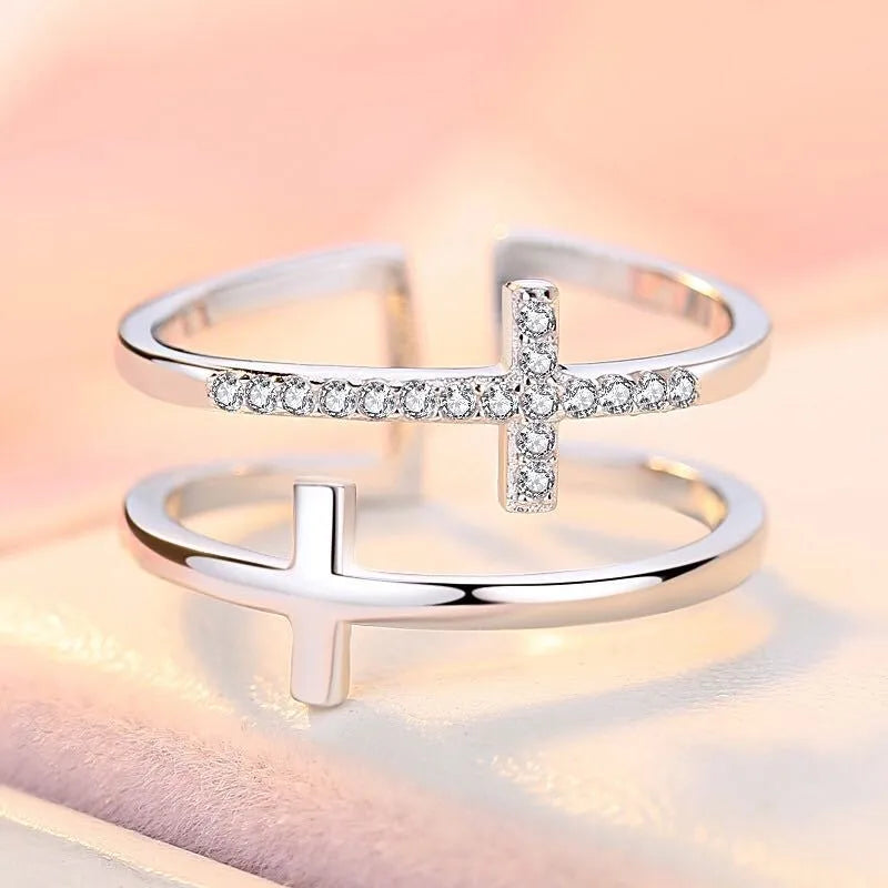 Adjustable copper ring with double cross design featuring zircon gems in sterling silver inlay, white gold colour
