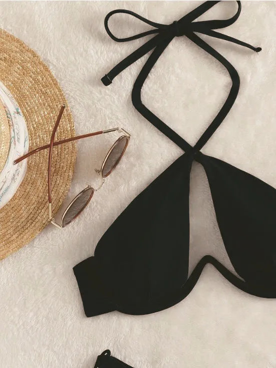 Women's halter neck bikini swimsuit in solid colour with backless design