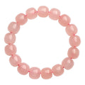 Pink crystal barrel bead bracelet with geometric design and 8 x 10mm bead sizing