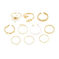 Gold openwork flower ring set showing floral design and glossy electroplated finish