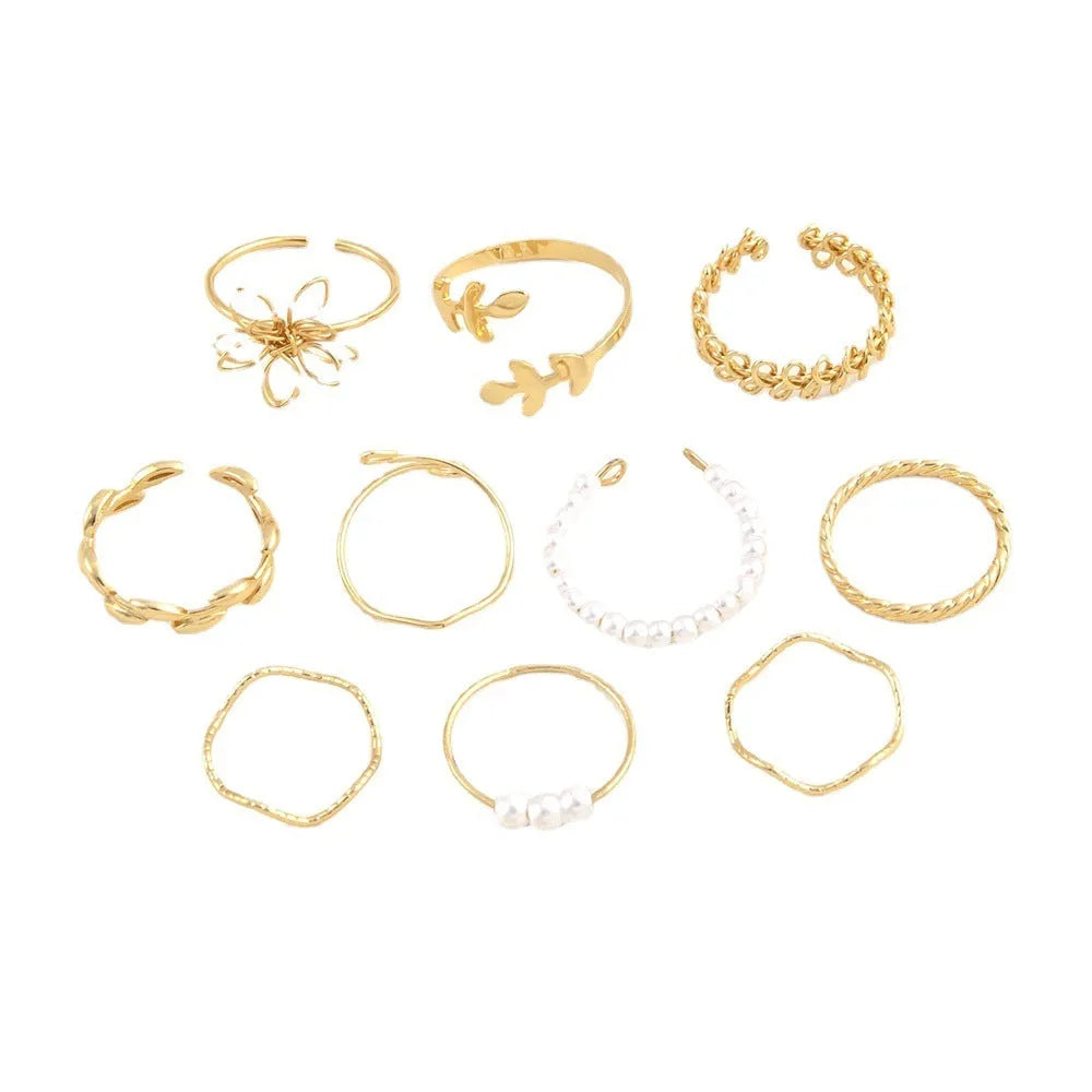 Gold openwork flower ring set showing floral design and glossy electroplated finish
