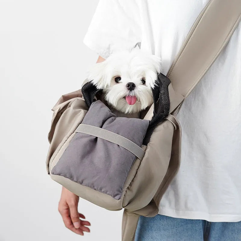Apricot coloured cloth pet handbag carrier with dimensions 41 cm by 16 cm by 28 cm.