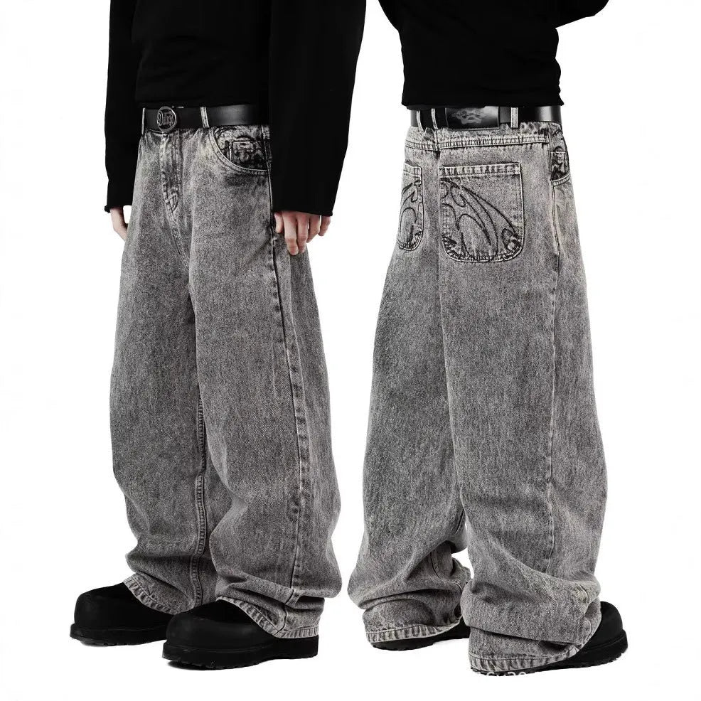Grey loose straight-leg denim trousers with mid-waist styling on hanger