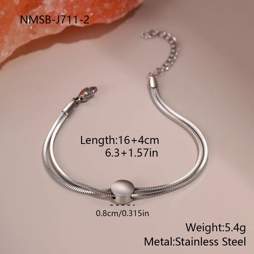 Women's 18K gold plated titanium steel snake chain bracelet on wrist