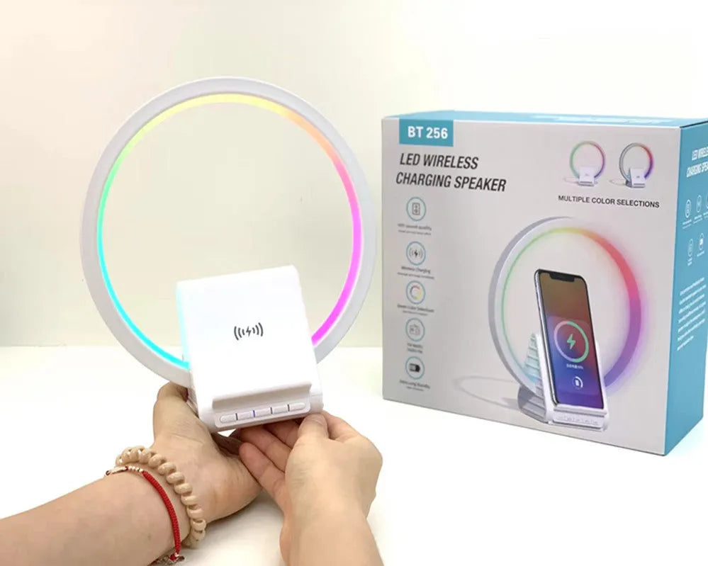 White smart Bluetooth speaker with ambient light ring and wireless charging surface