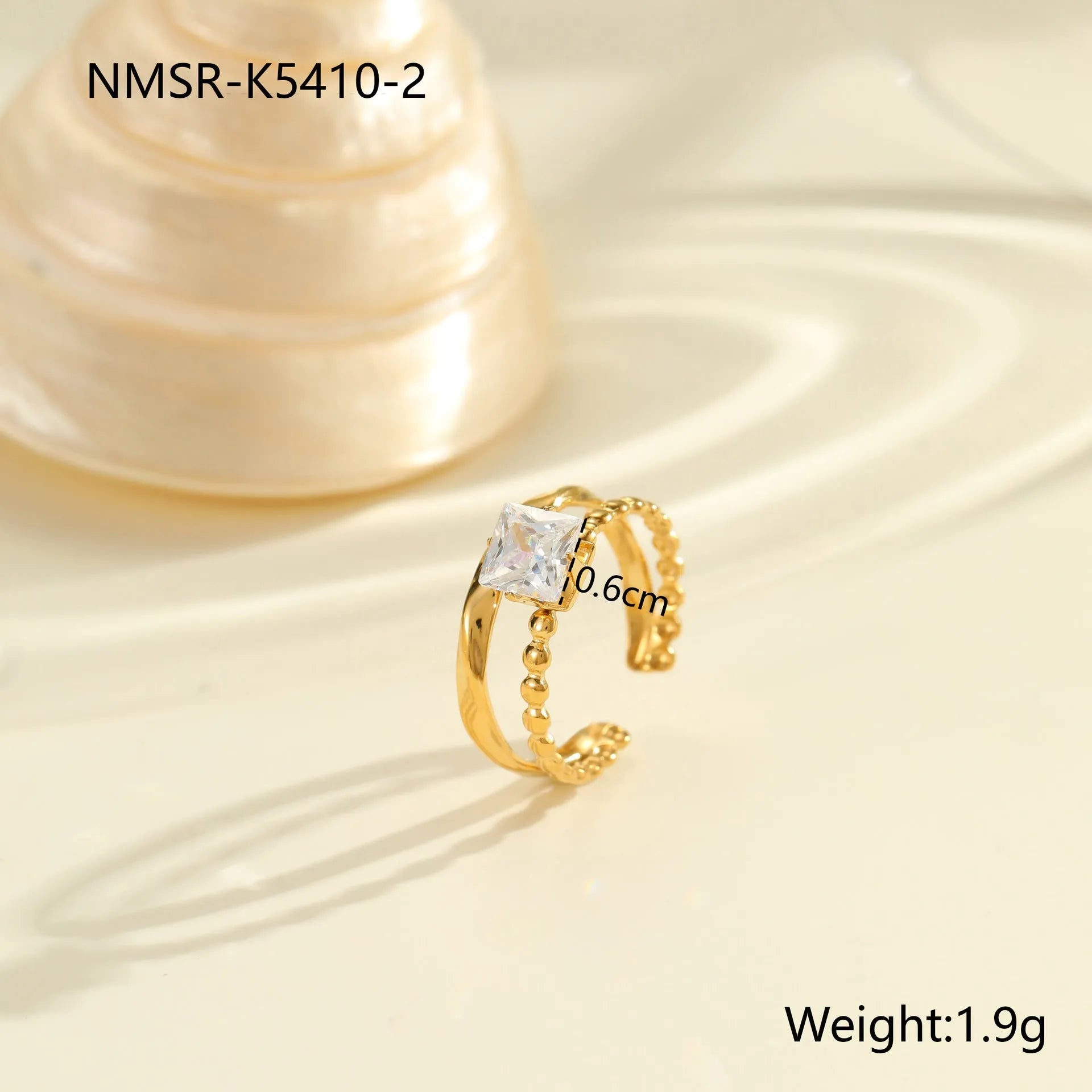 Open mouth geometric stainless steel ring with heart drop shape and gold inlaid zircon.