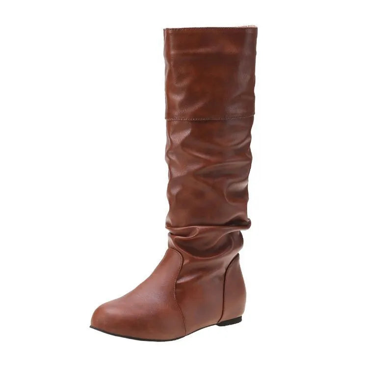 Women's black slip-on flat ankle boots with round toe and rubber sole.