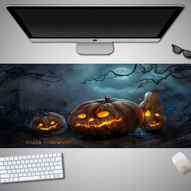 Large Halloween-themed computer mouse pad with graphic design on a desk
