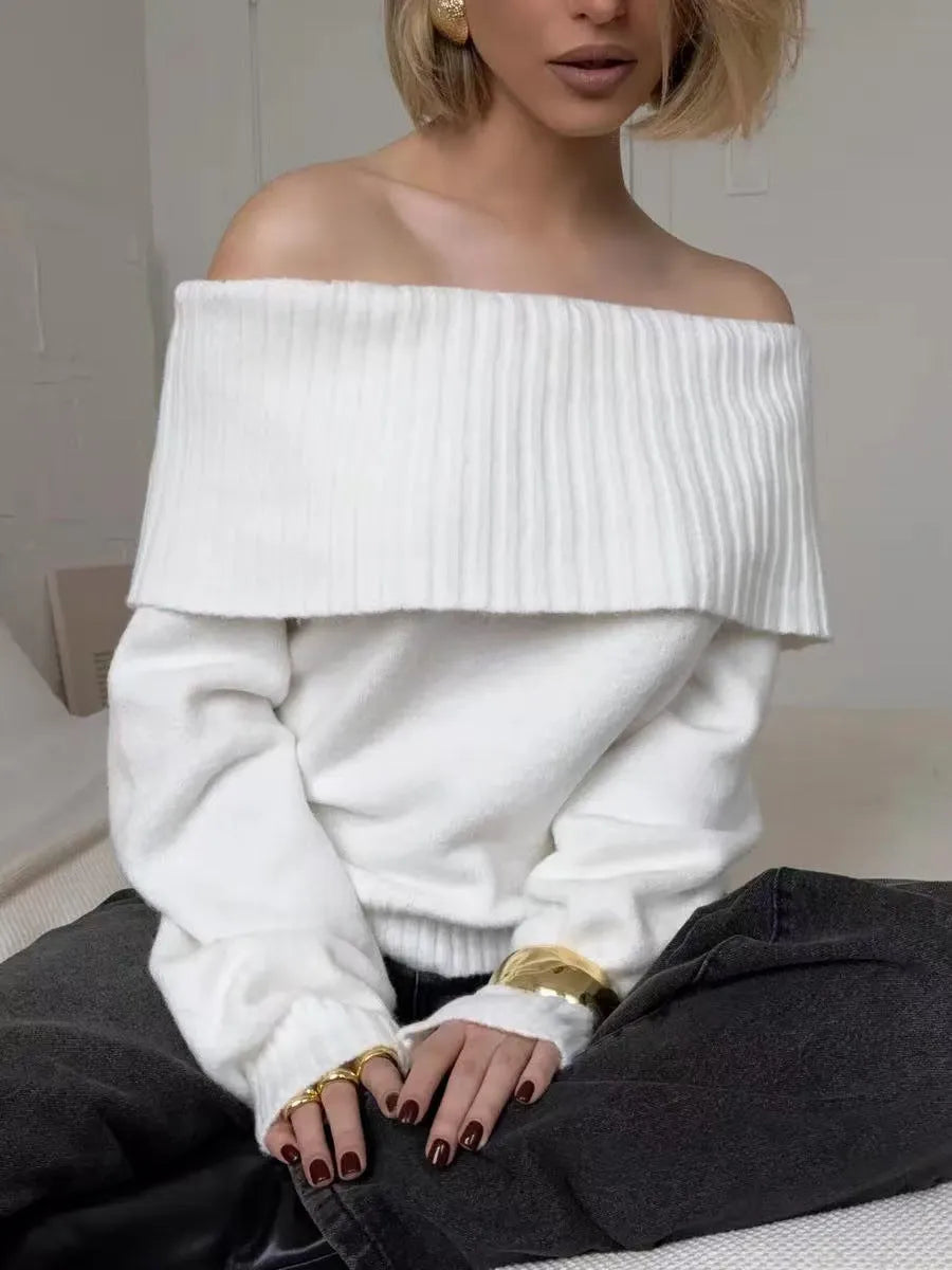 Grey off-the-shoulder sweater with a 3D pattern texture, showing strapless neckline design.