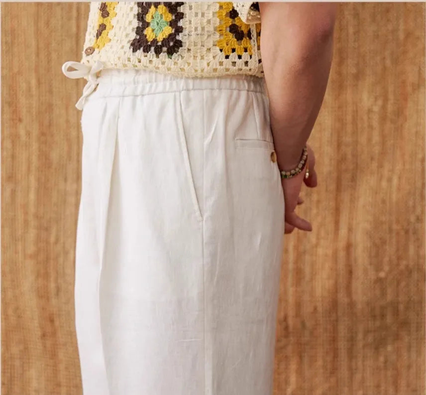 Linen straight-leg trousers with elasticated high waist and lace trim detail in navy blue colour