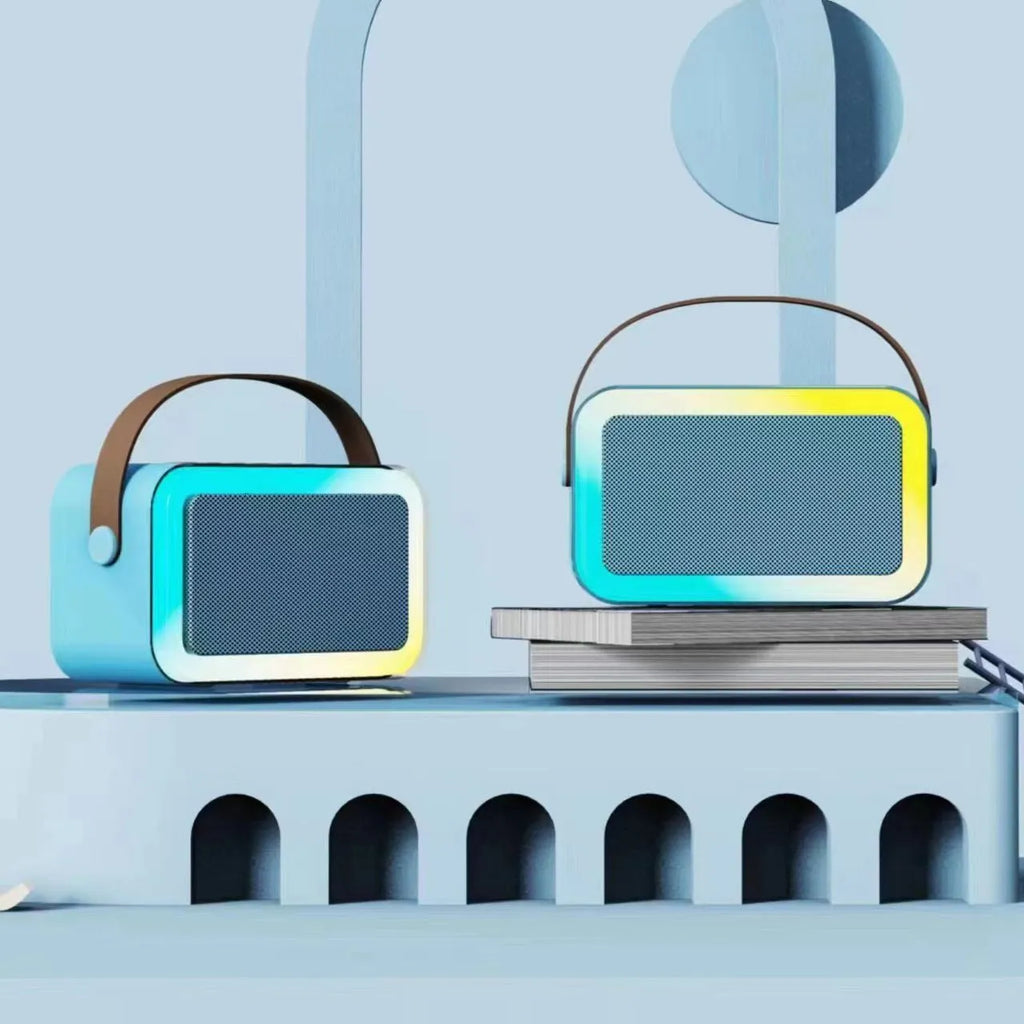 Portable Bluetooth speaker with microphone and coloured LED lights in pink, sky blue, or white.