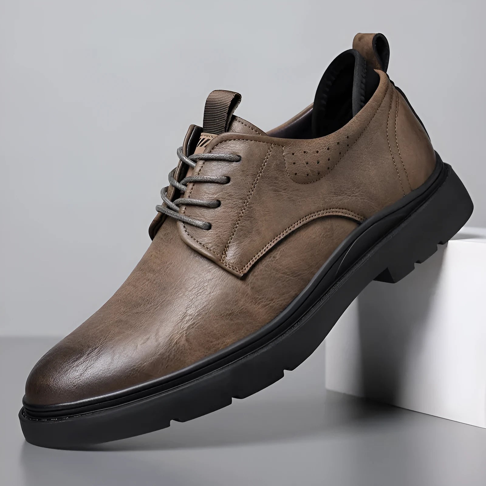 Men's black and brown leather casual sneakers with rubber soles and sewn detailing
