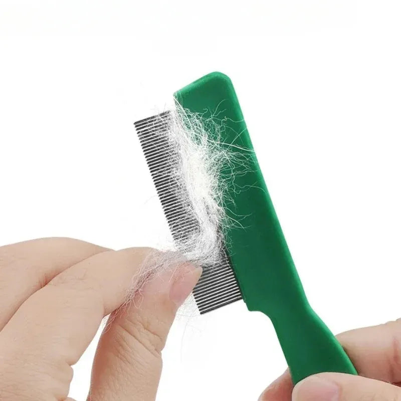 Green plastic handle stainless steel pin flea comb for dogs and cats on a white background.