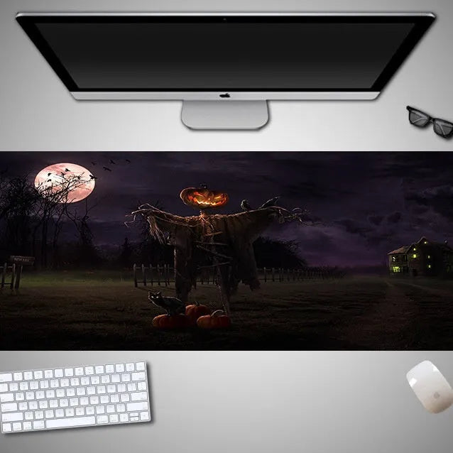 Large Halloween-themed computer mouse pad with graphic design on a desk